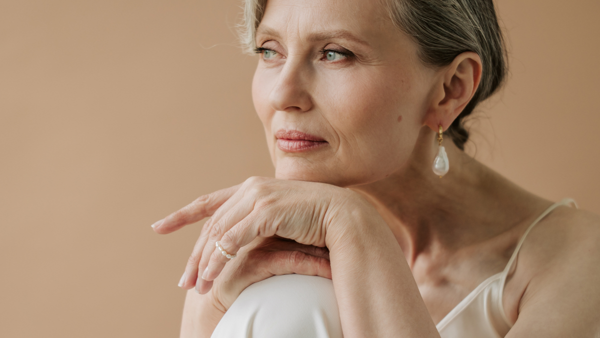 Woman in midlife illustrating dry skin and skincare changes during menopause