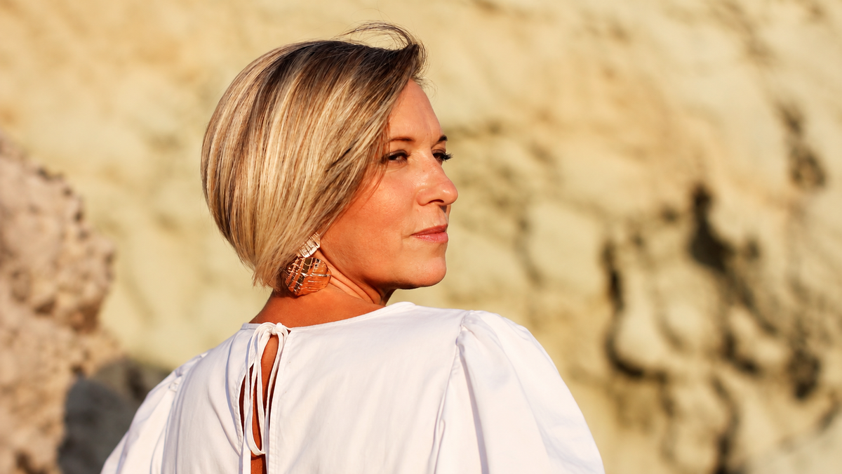 Woman in midlife with natural skin, illustrating changes during perimenopause